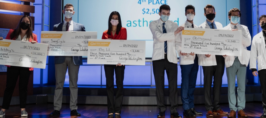 Picture of all the NVC Winners holding checks